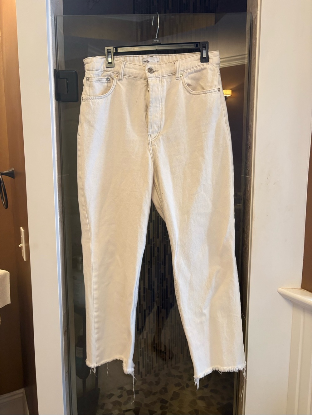 Women’s Zara frayed edged jeans.